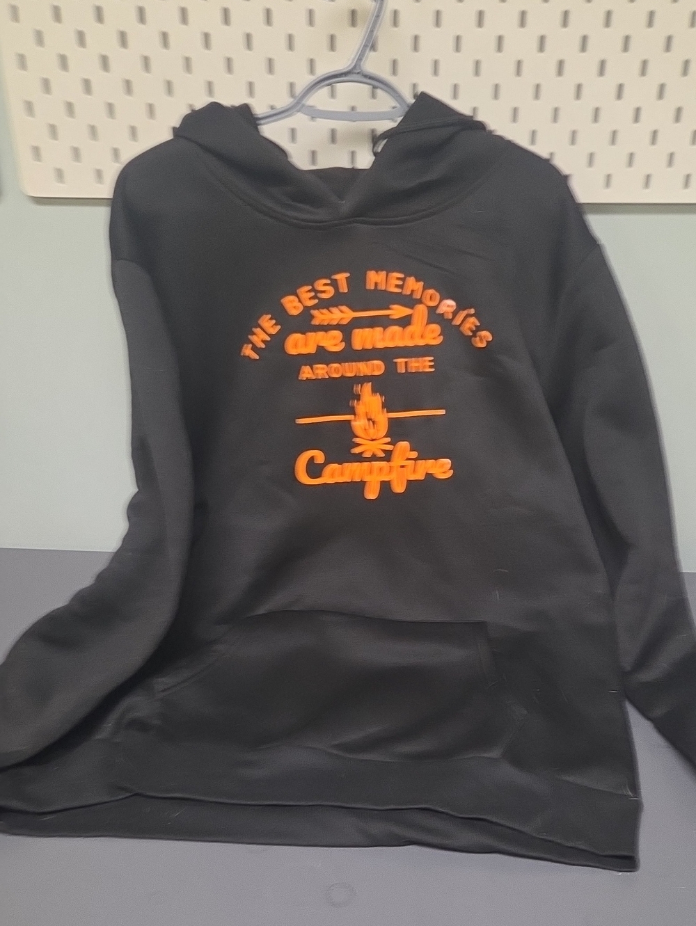 Black Men's Hoodie with Orange Campfire Typography